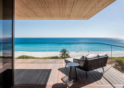 Photograph of a terrace at Arte Surfside condo with a view of the ocean.