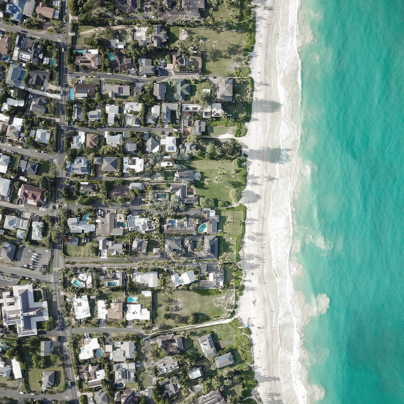 Top aerial view of homes in a private beach.